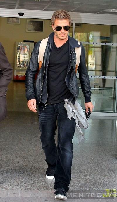 David Beckham is decked out in a Burberry backpack and scarf as he arrives at an airport in Nice, France on Tuesday (June 29, 2010).